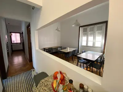 a room with a table and a dining room at BREINER 28 in Porto