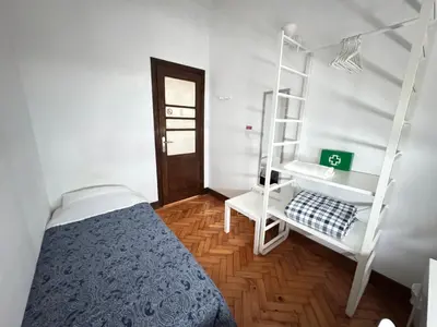 a bedroom with a bunk bed and a ladder at BREINER 28 in Porto