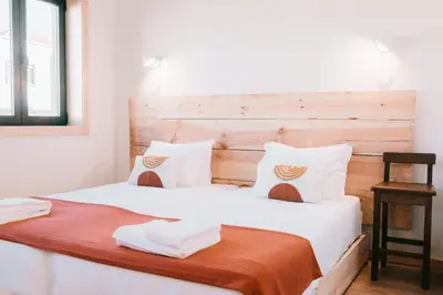 two beds with white sheets and pillows in a room at Campanha Apartment By Porto Stories in Porto