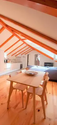 a dining room with a table and a couch at A Window to Porto - Fabulous apartment by Douro River in Porto