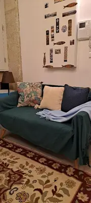 a bed sitting on the floor in a room at FLH Porto Santa Catarina Cosy Flat in Porto