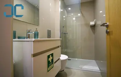 a bathroom with a sink and a toilet and a shower at Sogra Apartment by JC with Balcony in Porto
