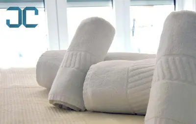 a pair of white socks sitting on top of a bed at Sogra Apartment by JC with Balcony in Porto