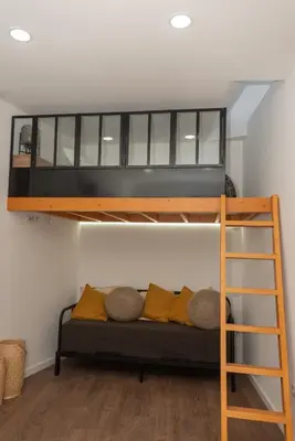 a bedroom with a bunk bed and a ladder at Fervença Great Stay Apartment in Vila Nova de Gaia