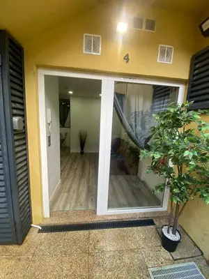 a sliding glass door of a house with a hallway at Fervença Great Stay Apartment in Vila Nova de Gaia
