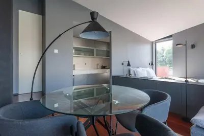 a dining room with a glass table and chairs at MY DOURO VIEW Stylish Gem River Front in Massarelos