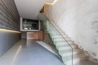 a staircase in a house with a glass railing at MY DOURO VIEW Stylish Gem River Front in Massarelos