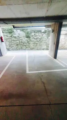 an empty parking garage with a stone wall at MY DOURO VIEW Stylish Gem River Front in Massarelos