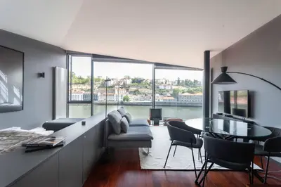 a living room with a couch and a table at MY DOURO VIEW Stylish Gem River Front in Massarelos