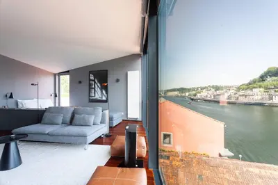 a living room with a view of the water at MY DOURO VIEW Stylish Gem River Front in Massarelos