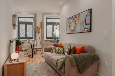 a living room with a couch and a table at Swimming Pool Luxury House, with AC Downtown Porto in Porto