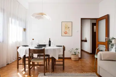 a dining room with a table and chairs at ! Bright 2BR Hammock Flat ! Praça da República in Porto