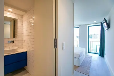 a bathroom with a toilet and a sink at Loulé Luxury Garden W/ AC in Porto