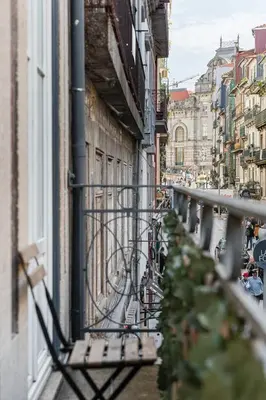 a balcony with a bench on the side of a building at GuestReady - Amazing Studio in the heart of Porto in Porto