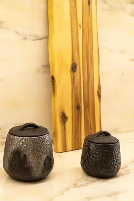 two black objects sitting on top of a wooden floor at Taipas Townhouse 1865_Boutique Apart in Porto