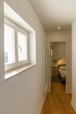 a bedroom with a window and a bed in a room at Taipas Townhouse 1865_Boutique Apart in Porto