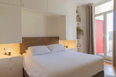 a bedroom with a white bed and a window at Taipas Townhouse 1865_Boutique Apart in Porto