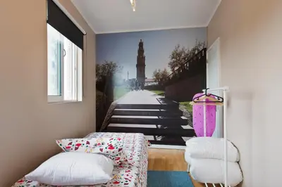 a room with a wall with a picture of a stairway at Oporto Blue Lapa - Spacious Family Apartment With Winter Garden in Porto