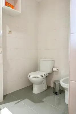 a room with a tv on a wall with a chair at Lovely Cedofeita Apartment by Unique Hosts in Porto