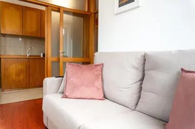 a white bathroom with a toilet and a sink at Lovely Cedofeita Apartment by Unique Hosts in Porto