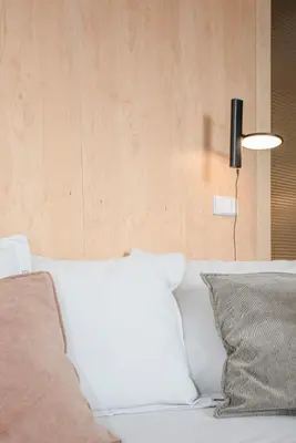 a bed with a white pillow and a lamp at Liiiving in Porto - Bolhão Trendy Apartments in Porto