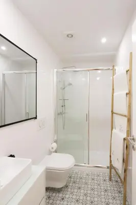 a bathroom with a shower and a toilet and a sink at HM – Historic Downtown Batalha Studio in Porto