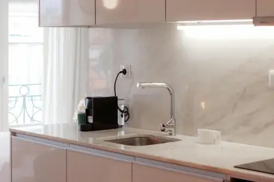 a kitchen with a sink and a counter top at HM – Historic Downtown Batalha Studio in Porto