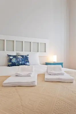 a large white bed with two pillows on it at ORM Catedral & São Bento & Luiz Apartments in Porto