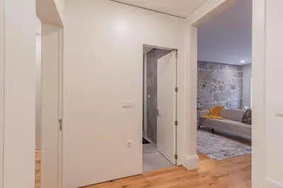 a hallway with a door leading to a living room at Rodrigues de Freitas 391 by LovelyStay in Porto