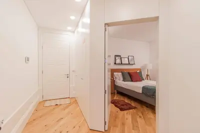 a bedroom with a bed and a mirror at Rodrigues de Freitas 391 by LovelyStay in Porto