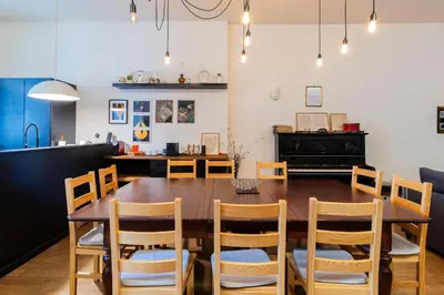 a dining room with a wooden table and chairs at Music Shell by LovelyStay in Porto