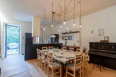 a dining room with a table and a piano at Music Shell by LovelyStay in Porto
