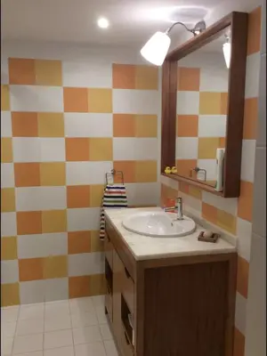 a bathroom with a sink and a mirror at Casa do Teatro in Porto