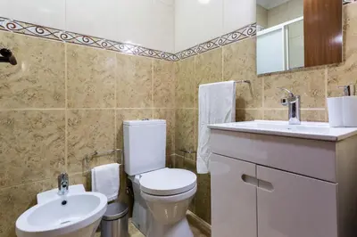 a bathroom with a toilet and a sink at Porto Residence Campanhã in Porto