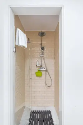 a bathroom with a shower with a shower head at GuestReady - Bright home in the heart of Porto in Porto