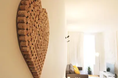 a mirror hanging on a wall in a living room at Cativo Design Apartment in Porto