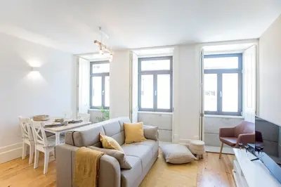 a living room with a couch and a table at Cosy Flat Near Douro in Porto
