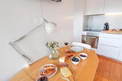 a table with plates of food on it in a kitchen at Douro Dreams in Porto