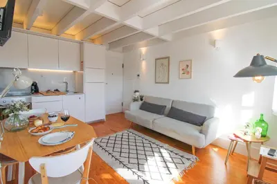 a living room with a table and a couch at Douro Dreams in Porto