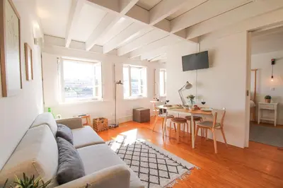 a living room with a couch and a table at Douro Dreams in Porto