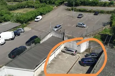 a parking lot with a bunch of cars parked in it at Aida's Haven Penthouse&Parking in Porto