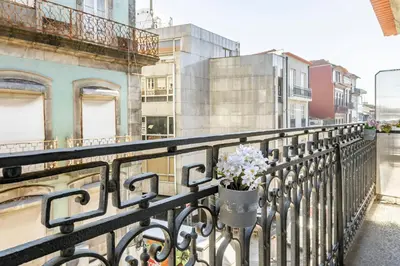 a living room with a couch and a flat screen tv at Almada Glamorous & Chic Oporto Downtown in Porto