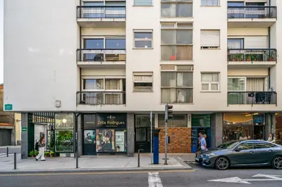 a building on a city street with a car parked in front at WHome FT169 Top Location 2-Bed Perfect to explore Porto in Porto