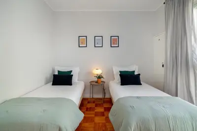 two beds sitting next to each other in a room at WHome FT169 Top Location 2-Bed Perfect to explore Porto in Porto