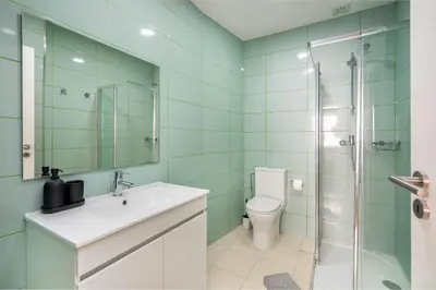 a bathroom with a toilet and a sink and a shower at WHome FT169 Top Location 2-Bed Perfect to explore Porto in Porto