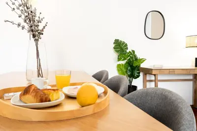 a tray of food on a table with a plate of food at Feel Porto Classic Apartment in Porto