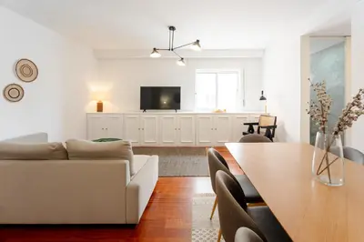 a living room with a couch and a table at Feel Porto Classic Apartment in Porto