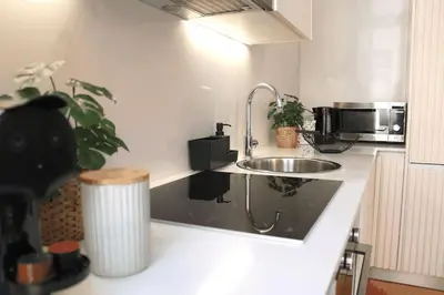 a kitchen with a sink and a microwave at Luxury Porto Unique in Porto