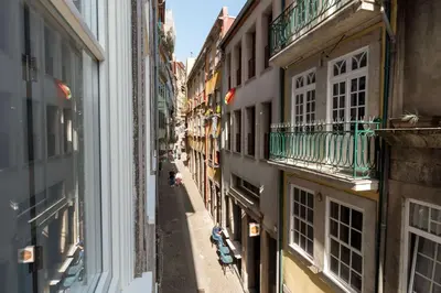 a view of an alley between two buildings at Riverside Cozy Studio by LovelyStay in Porto
