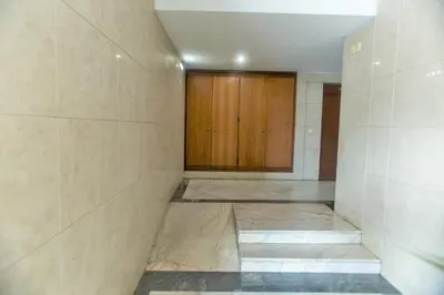 a room with a hallway with a wooden cabinet at Republica Square Apartment by Porto City Hosts in Porto